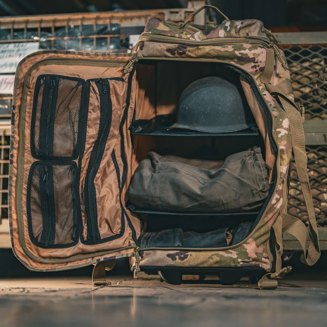 Olympus G4 opened side-on, three ABS shelves loaded with a helmet, gear bag and boots
