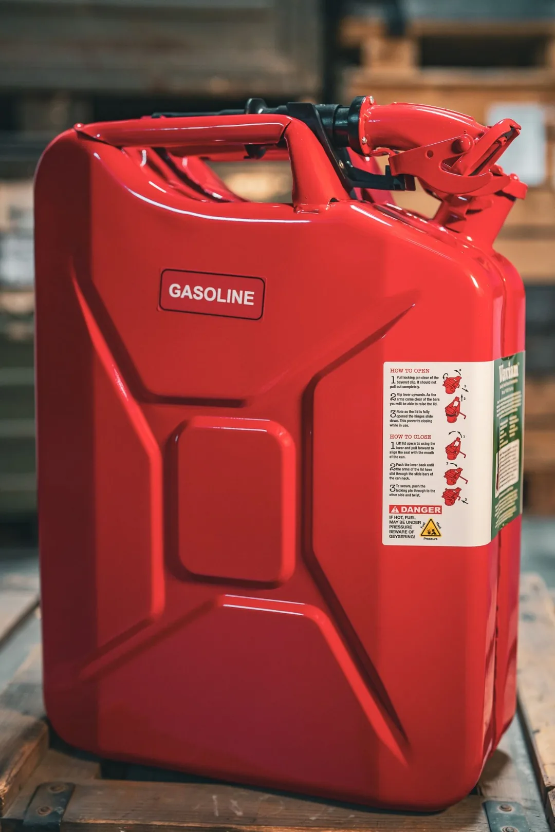 Red Wavian 20 liter jerry can on a wood pallet inside the Swiss Link warehouse