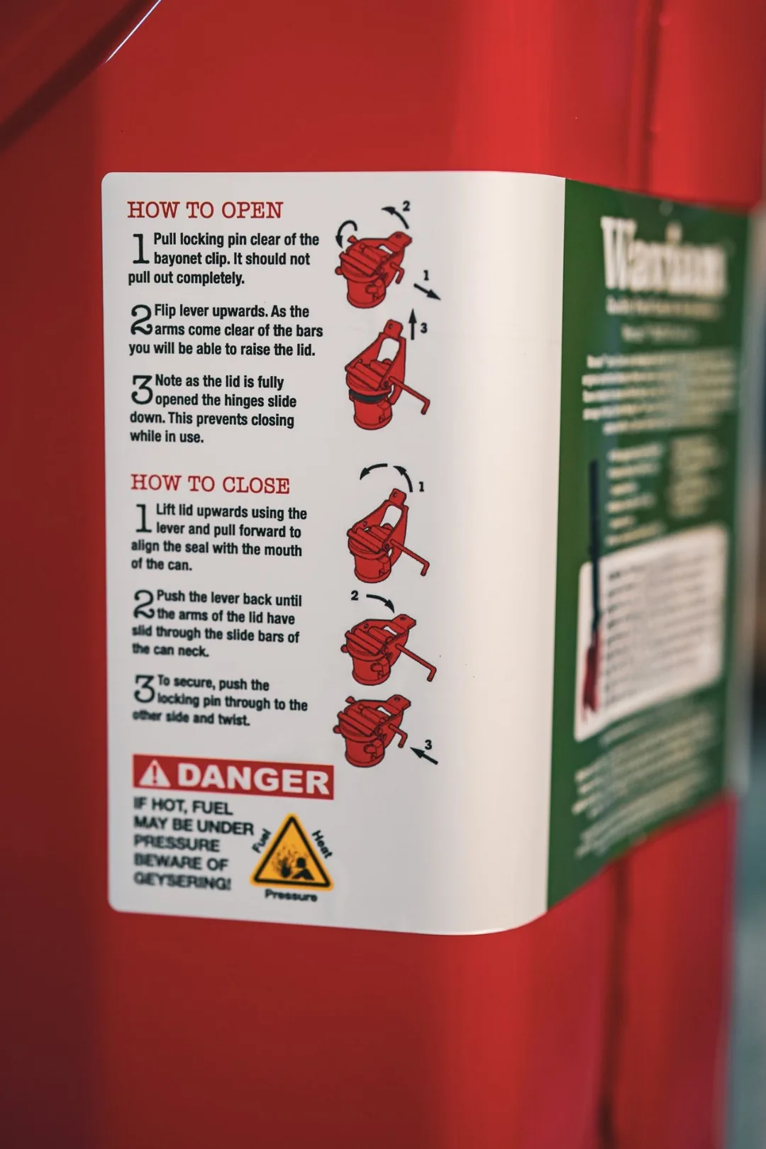 Wavian how-to-open and how-to-close instruction label on the side of the jerry can